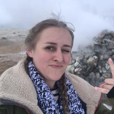 Picture of Ashley Brant in front of a geyser.