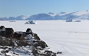 Arctic village on the coast in winter